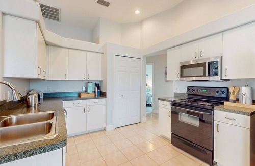 Pinehurst House | Canal-front home with private heated pool, patio, canal views & bikes