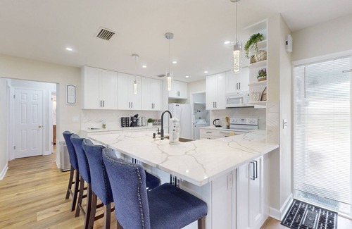 Clearwater House | Canal-front home with private pool, dock, grill, canal views, & W/D