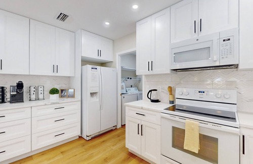 Clearwater House | Canal-front home with private pool, dock, grill, canal views, & W/D