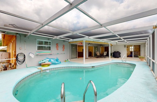 Clearwater House | Canal-front home with private pool, dock, grill, canal views, & W/D