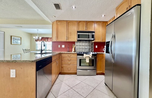 Capri Isle Condo | Canal-View Gem w/Pool in Treasure Island Paradise