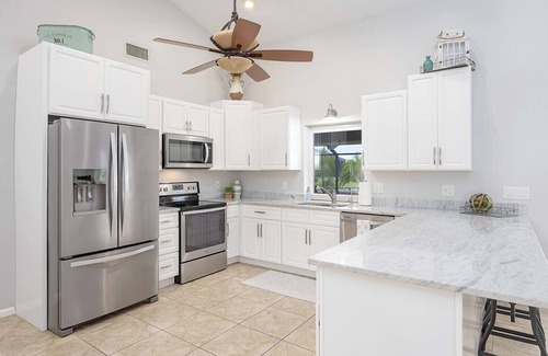 Cape Coral House | Canalfront/Outdoor Kitchen/Pool/Spa/Boat Dock