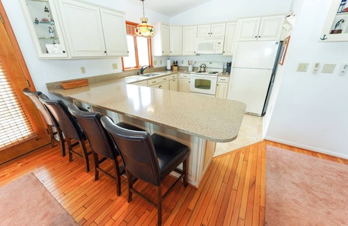 South Bethany Harbor House | Canalfront Retreat w/Dock, Kayaks & Screened Porch – Pet-Friendly!