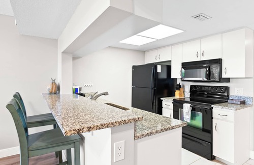 Port Canaveral Condo | Cape Canaveral Charm Double Wide Patio & Heated Amenities