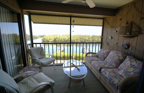 Bokeelia House | Captain's Harbor Condo Relax: on your private screened balcony and enjoy the scenery just outside this gorgeous condo.