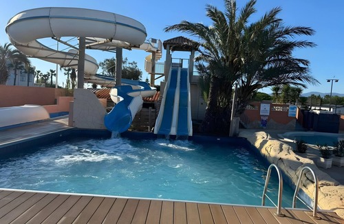 Canet-Plage RV Rental | Caravan 'Cosy Vue Sur L'étang' with Sea View, Shared Pool and Air Conditioning