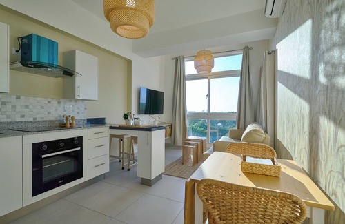 Quisqueya Apartment | Caribbean Sunset Soak Apt.In the center of town, steps from the Juan Dolio Beach