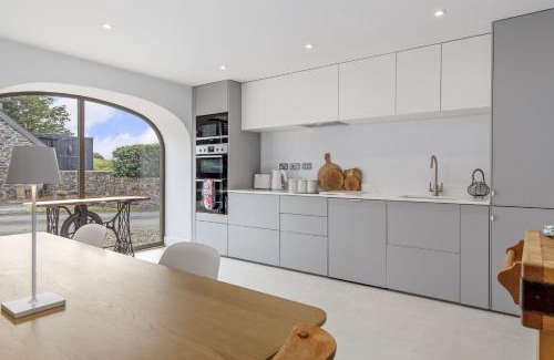 Carmarthen House | Cartws at Pentrecelyn - styilish barn conversion with large kitchen and outdoor space