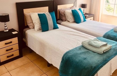 Puerto del Carmen Apartment | Casa Kazz, lovely 1 bed central PDC apartment with sea & pool views