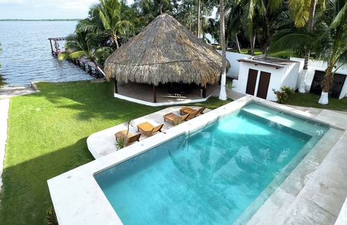 Othon P. Blanco Villa | Casa Xchel in front of the bay, pool, jacuzzi and deck.