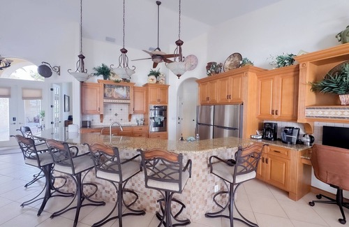 Fort Myers House | CasaSuLago Sunset Lakefront, Saltwater Pool & Spa, Fishing, Kayaks & Game Room!