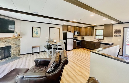 Lake Shore Estates House | Castle Rock Lakefront Home, with pier, sand bottom, and wrap around deck