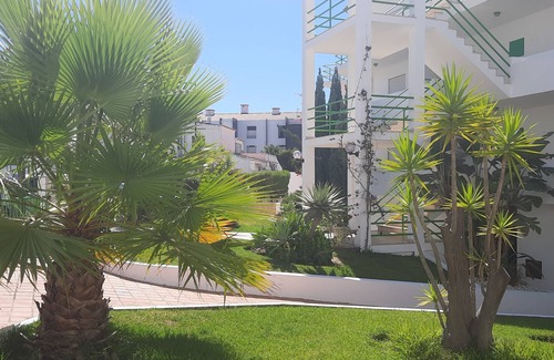 Areias de Sao Joao Apartment | Central apartment by the sea with pool and garden for 4 people.