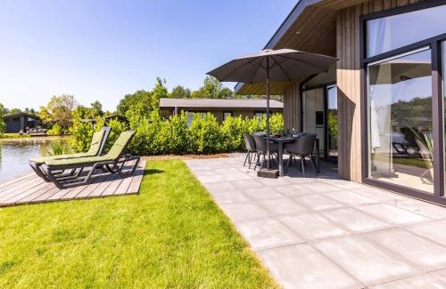 Municipality of Veldhoven Ski Chalet | Chalet by Pond in Holiday Park