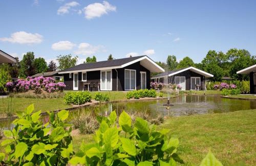 Municipality of Veldhoven Ski Chalet | Chalet in Netherlands by Scenic Pond