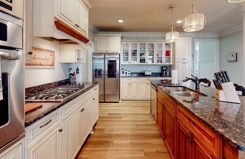 Riverwood Plantation House | Champions Retreat | Dog-friendly home with fireplace, grill, and sunny patio