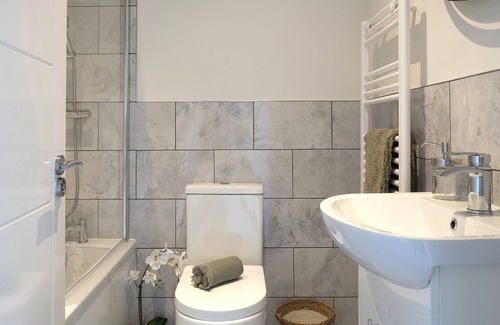 Saint Asaph Apartment | Chapel renovation Free on-site parking Zip-link beds Double sofa bed