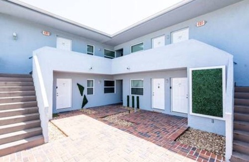 Coral Heights Apartment | Charlie Chaplin - A Timeless Modern Escape!