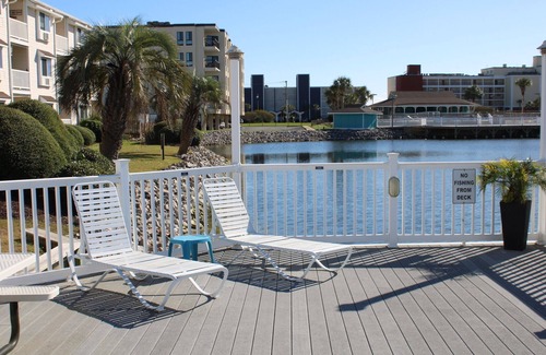 North Myrtle Beach Apartment | Charming 2-bedroom condo offering serene living with picturesque pond vistas, with a lovely pool!