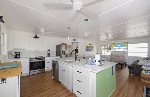 Fort Myers Beach House | Charming 2-Bed Home with Pool, Tiki Hut, Canal Access, & Steps to Beach & Dining