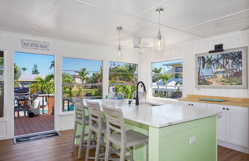 Fort Myers Beach House | Charming 2-Bed Home with Pool, Tiki Hut, Canal Access, & Steps to Beach & Dining