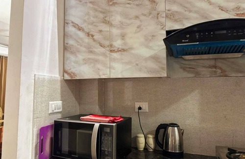 Noida Apartment | Charming 2-bedroom apartment with Pool View