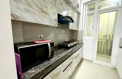 Noida Apartment | Charming 2-bedroom apartment with Pool View