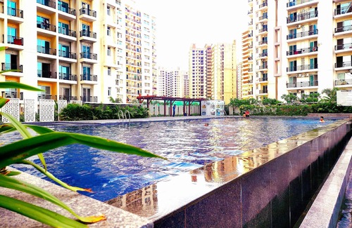 Noida Apartment | Charming 2-bedroom apartment with Pool View