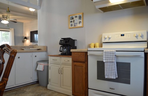 Tranquil Harbour House | Charming 2-bedroom House with screened in porch WiFi, AC in beautiful Oak Island