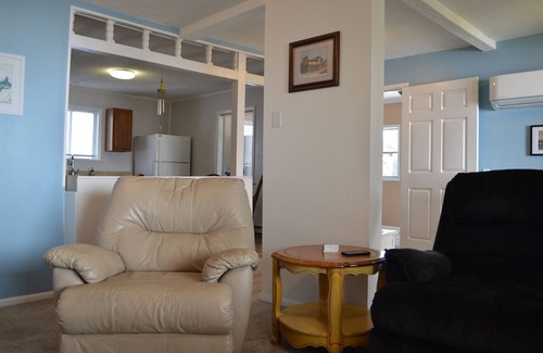 Tranquil Harbour House | Charming 2-bedroom House with screened in porch WiFi, AC in beautiful Oak Island