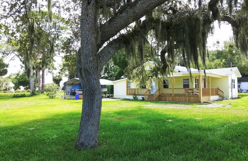 Edgewater House | Charming 3 bedroom 2 bath home w/wraparound veranda on one acre of land.