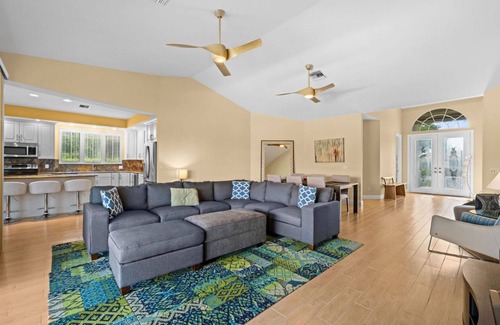 Waters Edge House | Charming 3-bedroom lake house in Fort Myers with screened-in pool & hot tub.