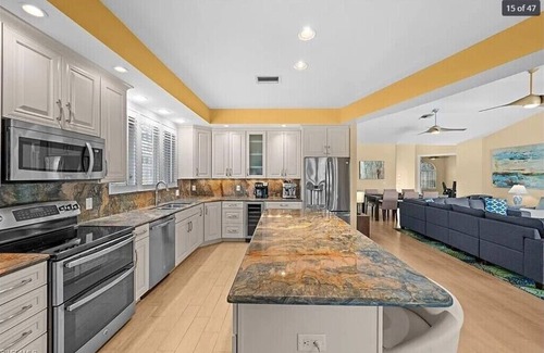 Waters Edge House | Charming 3-bedroom lake house in Fort Myers with screened-in pool & hot tub.