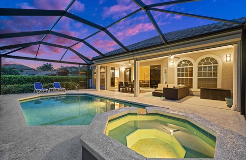 Waters Edge House | Charming 3-bedroom lake house in Fort Myers with screened-in pool & hot tub.