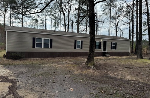 Bastrop House | Charming 3-bedroom mobile home in a peaceful country setting.