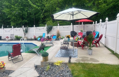 Neshannock Township House | Charming 4-bedroom house with fitness room and AC in New Castle.