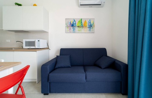Pachino Apartment | Charming 40 sqm apartment with sea view, accommodating up to 4 guests, located within the renowned Borgo 84 residence, which features a swimming pool and a cycling path. The property is just 3 km from the center of Marzamemi, one of the most picturesque