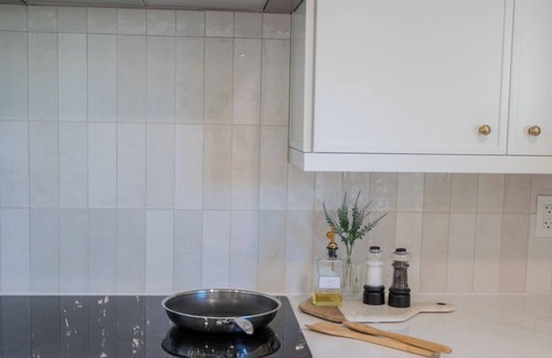 Butler Beach Cottage | Charming Cottage with Sauna, MINI Golf, 2 OD Showers, Firepit, 2 Tubs and more!