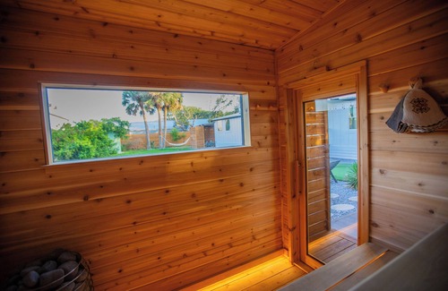 Butler Beach Cottage | Charming Cottage with Sauna, MINI Golf, 2 OD Showers, Firepit, 2 Tubs and more!