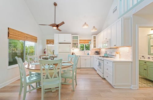 Anna Maria House | Charming cottage with heated pool, tropical landscaping in prime location.