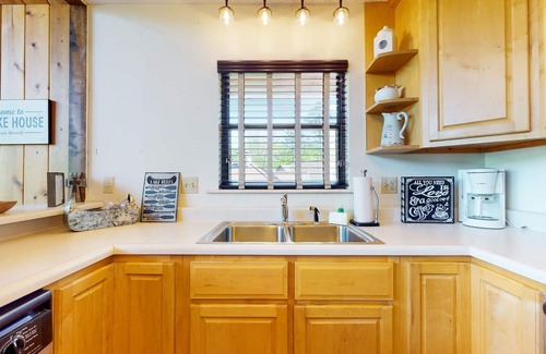 Big Creek House | Charming dog-friendly lakefront home w/dock, firepit, huge deck