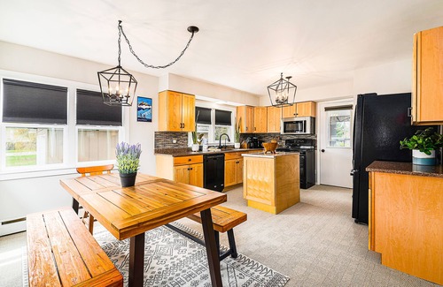 Petoskey House | Charming home with large backyard, firepit, grill, patio, and private W/D