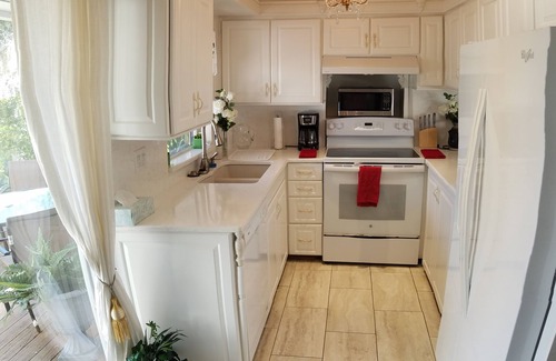 North Forest Hills House | Charming, lakefront cottage-like home with pool