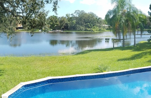 North Forest Hills House | Charming, lakefront cottage-like home with pool