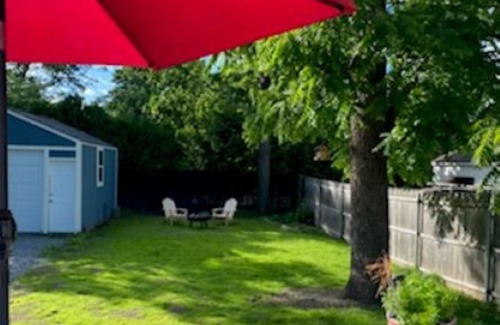 Riverhead House | Charming Riverhead home with large outdoor patio & backyard firepit