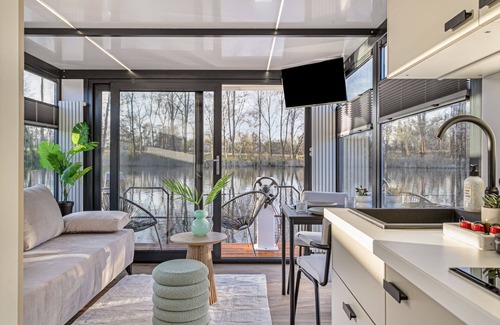 Municipality of Wijdemeren Boat Rental | Charming Tiny Houseboat Escape Near Amsterdam