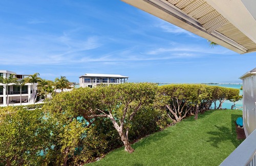 Marathon House | Charming townhome with ocean views, an open porch & steps from the water