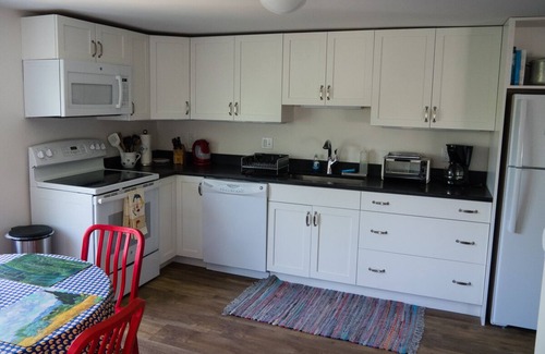 Commercial Street Condo | Cheerful, renovated condo with private beach and parking