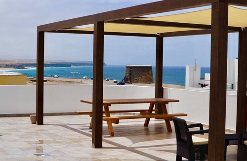 El Cotillo Apartment | Chic apartment with sea views on a sandy beach, large roof terrace and WiFi