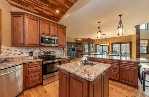 Waterfront Greens House | Chic Lake Access Home w/Hot Tub & Fireplaces